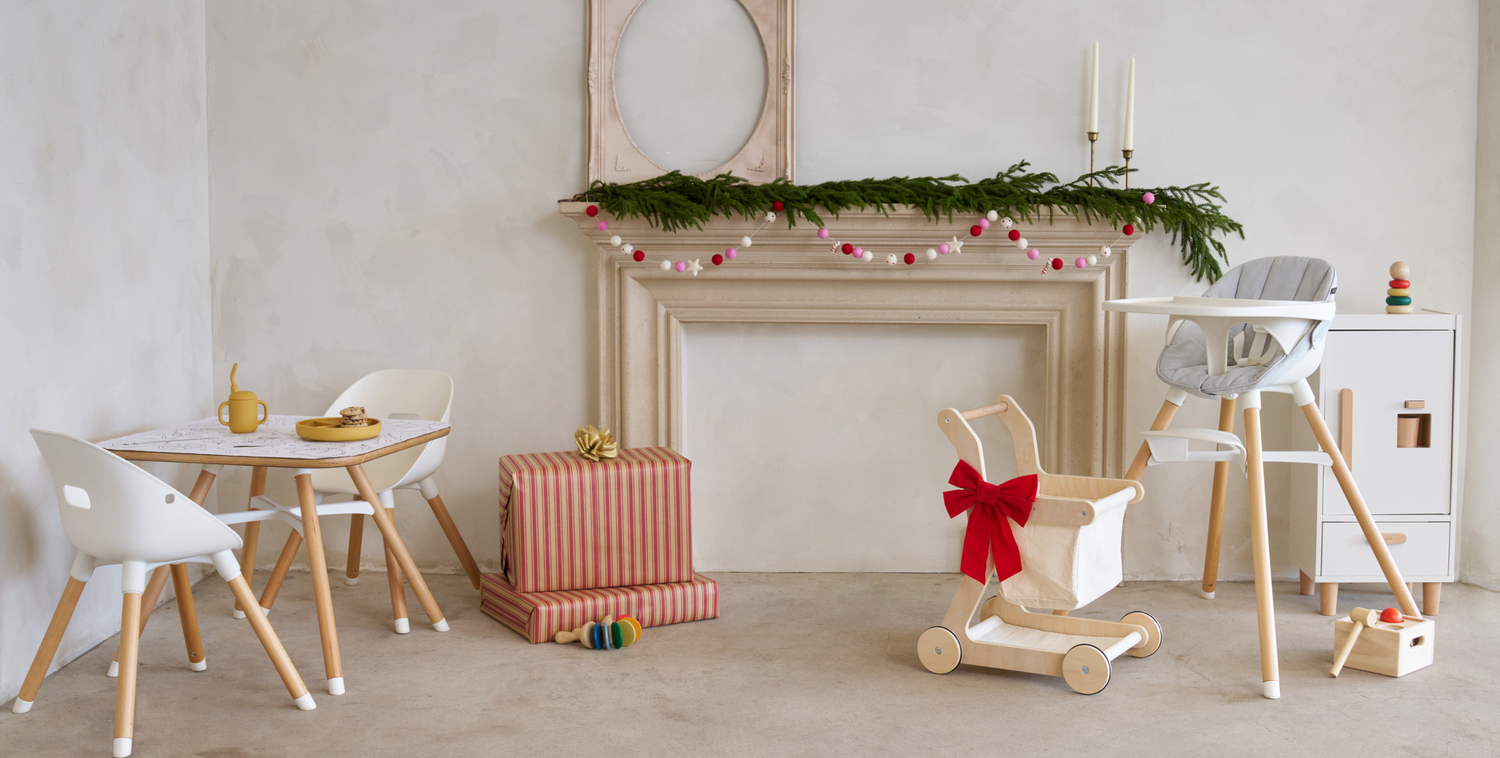 The Play Kit, The Chair, Shopping Cart and The Play Fridge in front of holiday decorations and wrapped gifts